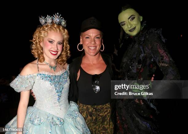 McKenzie Kurtz as "Glinda", Pink and Talia Suskauer as "Elphaba" pose backstage at the hit musical "Wicked" on Broadway at The Gershwin Theater on...