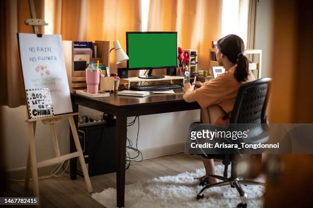 girl studying on computer at home college entrance exam preparation - examination table bildbanksfoton och bilder
