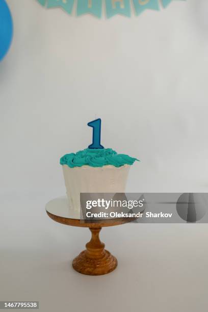 number 1 candle on a birthday cake - 1st birthday cake stock pictures, royalty-free photos & images