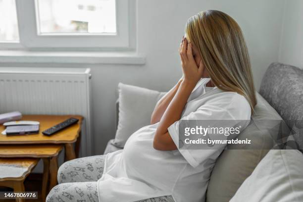 pregnant mother with depression and stress - giving birth stock pictures, royalty-free photos & images
