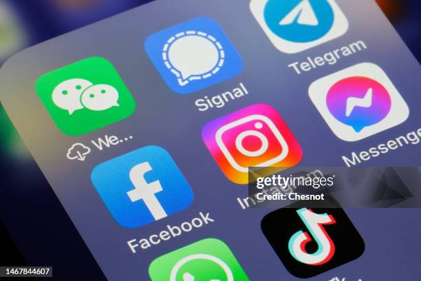 In this photo illustration, the logos of social media applications, Instagram, WhatsApp, Messenger, WeChat, Signal, Telegram, TikTok, Twitter and...