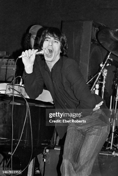 American actor/comedian Richard Belzer performing at The Bottom Line in New York City on March 3, 1979. He is pictured doing an impression of Mick...