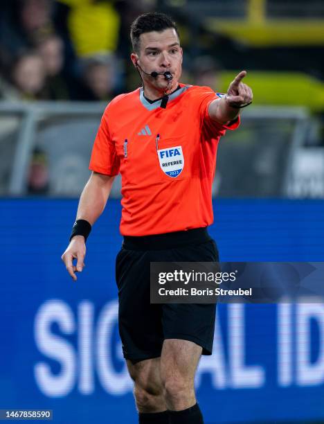 Referee Harm Osmers gestures during the Bundesliga match between Borussia Dortmund and Hertha BSC at Signal Iduna Park on February 19, 2023 in...