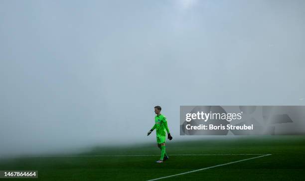 General view of the smoke on the inside of the stadium as fans of Hertha BSC burn flares as Oliver Christensen of Hertha Berlin looks on during the...