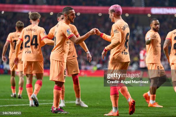 Antoine Griezmann of Atletico de Madrid celebrates with Koke after scoring the team's first goal during the LaLiga Santander match between Atletico...