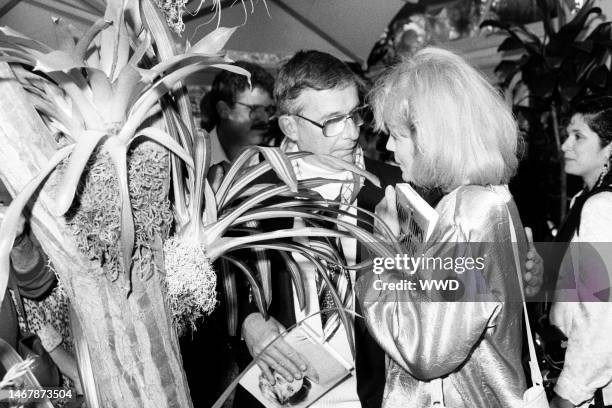 Roddy McDowall and Angie Dickinson attend a party in Beverly Hills, California, on June 25, 1987.