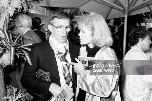 Roddy McDowall and Angie Dickinson attend a party in Beverly Hills, California, on June 25, 1987.