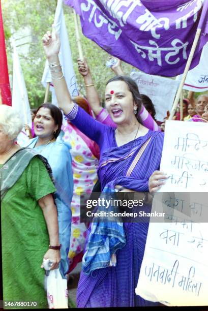 Bringa Karat leads workers of the Communist Party of India - Marxist protesting against mixing of religion with politics in New Delhi.