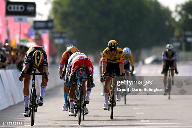 Tim Merlier of Belgium and Team Soudal Quick-Step, Caleb Ewan of Australia and Team Lotto Dstny and Olav Kooij of The Netherlands and Team...