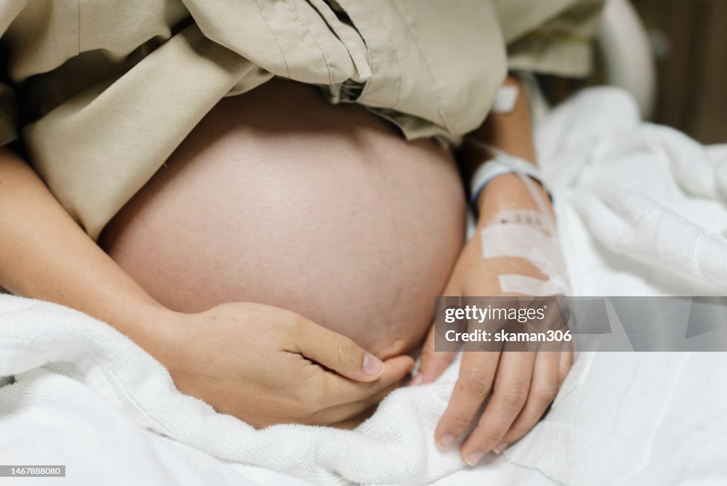 Close up Belly of Asian mother pregnant 40 weeks ready to give birth