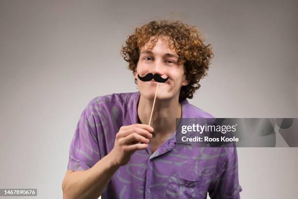 young man - moustache stock pictures, royalty-free photos & images