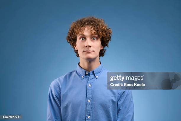 young man - portrait of business man looking surprised stock-fotos und bilder