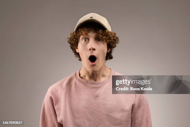 young man - surprised face stock pictures, royalty-free photos & images