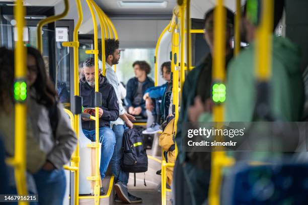 people travelling in bus - autobus stock pictures, royalty-free photos & images