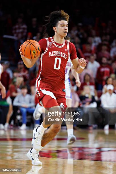 Anthony Black of the Arkansas Razorbacks drives down the court during a game against the Florida Gators at Bud Walton Arena on February 18, 2023 in...