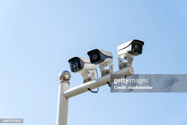 a set of surveillance cameras - security cameras stock pictures, royalty-free photos & images