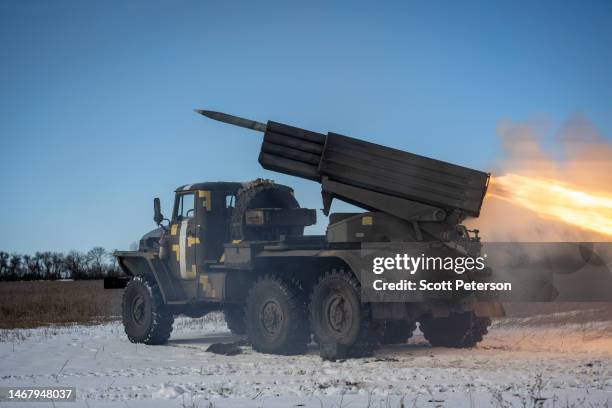 Ukrainian squad launches one of four rockets at a Russian infantry position from their BM-21 Grad 122mm multiple rocket launcher, in the southern...