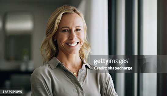 Leadership, portrait and business woman in the office with positive, happy and optimistic mindset. Happiness, smile and professional mature female executive boss standing with confidence in workplace Leadership, portrait and business woman in the office with positive, happy and optimistic mindset. Happiness, smile and professional mature female executive boss standing with confidence in workplace