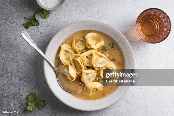 comfort food, vegetarian meal, soup with pearl barley, tortellini with spinach and ricotta in vegetable stock - tortellini stock pictures, royalty-free photos & images