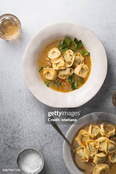 comfort food, vegetarian meal, soup with pearl barley, tortellini with spinach and ricotta in vegetable stock - tortellini stock pictures, royalty-free photos & images