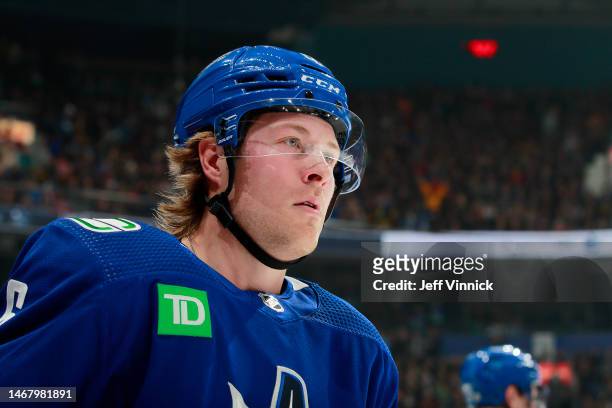 Brock Boeser of the Vancouver Canucks looks on from the bench during their NHL game against the Philadelphia Flyers at Rogers Arena February 18, 2023...