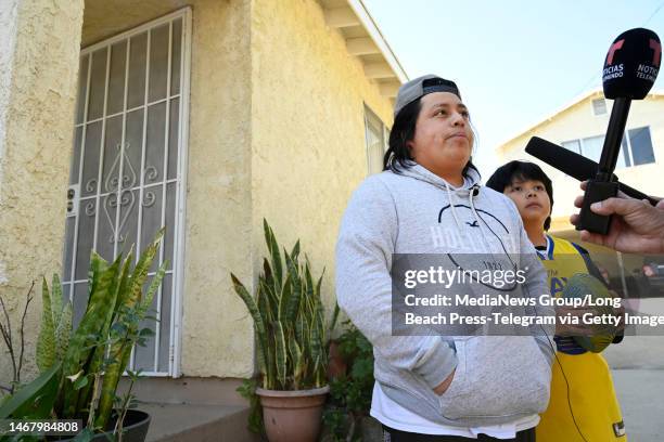 Carson, CA Luis and Ayden Lopez stand in front of their neighbors home located at 20400 S. Kenwood Avenue where a man believed to be a possible...