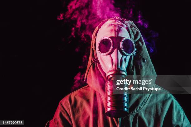 man in a gas mask - biochemical weapon stock pictures, royalty-free photos & images