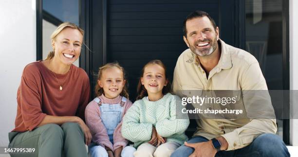 front door, parents and children portrait for real estate, property and mortgage success, happy and home love. happy family, mom and dad or people with kids relax outdoor patio of new house together - real people family portraits stockfoto's en -beelden