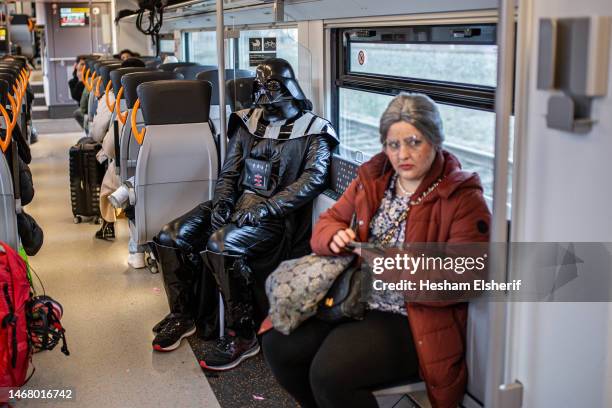 Commuter, wearing a "Star Wars" costume, is seen on the train on his way to attend the annual Rose Monday carnival parade on February 20, 2023 in...