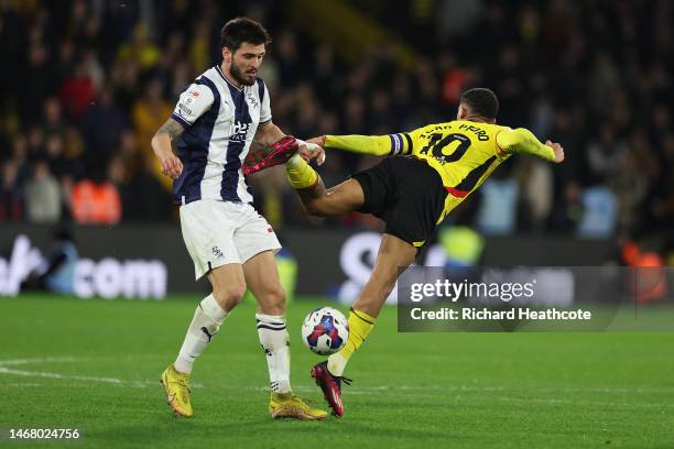 Okay Yokuslu of West Bromwich Albion challenges Joao Pedro of Watford for the ball during the Sky Bet Championship match between Watford and West...