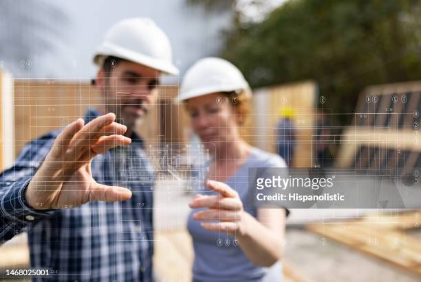 architects using technology while developing a construction project - housing infographic stock pictures, royalty-free photos & images