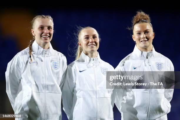 Aggie Beever-Jones, Laura Blindkilde-Brown and Ruby Mace of England smile as they line up prior to the International Friendly match between England...