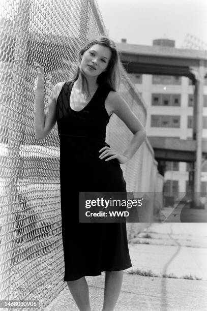 Model Kate Moss in a black slip dress from the CK by Calvin Klein 1994 resort collection advance, photographed on the streets of Manhattan.