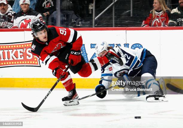 Dawson Mercer of the New Jersey Devils skates against the Winnipeg Jets at the Prudential Center on February 19, 2023 in Newark, New Jersey.
