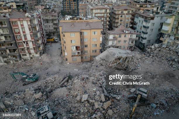 Bulldozers work to clear the rubble of destroyed buildings on February 20, 2023 in Hatay, Turkey. A 7.8-magnitude earthquake hit near Gaziantep,...