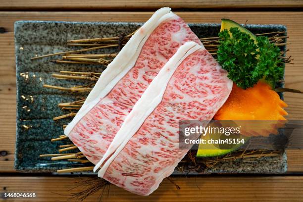 raw beef slide wagyu for japan bbq yakiniku in japanese restaurant. food concept. - wagyu beef stock-fotos und bilder