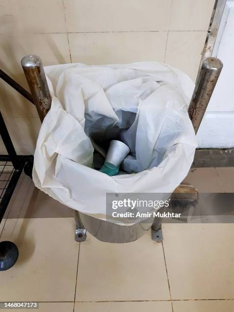 garbage trash bag in medical stainless steel garbage trash can bin in hospital ward. - pakistan hospital stock pictures, royalty-free photos & images