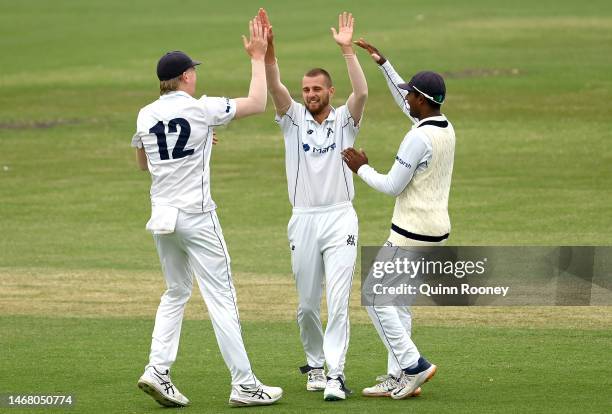 Fergus O'Neill of Victoria is congratulated for getting the wicket of Jake Lehmann of South Australia during the Sheffield Shield match between...