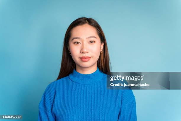 young woman in sweater looking at camera - knitted stock pictures, royalty-free photos & images