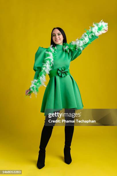 beautiful woman wearing green dress - baby doll dress stock pictures, royalty-free photos & images