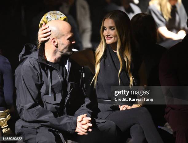 Jason Statham and Rosie Huntington-Whiteley attend the Burberry show during London Fashion Week February 2023 in Kennington Park on February 20, 2023...