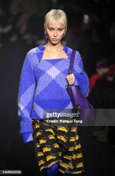 Iris Law walks the runway at the Burberry show during London Fashion Week February 2023 in Kennington Park on February 20, 2023 in London, England.