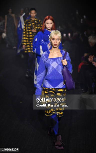 Iris Law walks the runway at the Burberry show during London Fashion Week February 2023 in Kennington Park on February 20, 2023 in London, England.