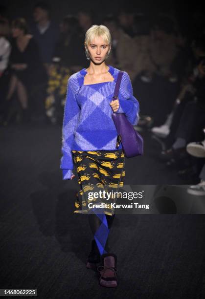 Iris Law walks the runway at the Burberry show during London Fashion Week February 2023 in Kennington Park on February 20, 2023 in London, England.