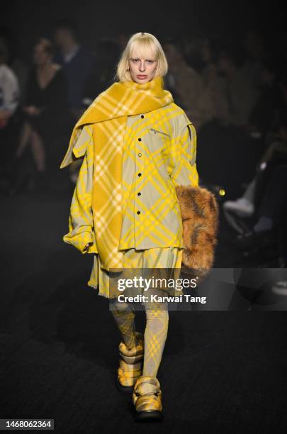 Model walks the runway at the Burberry show during London Fashion Week February 2023 in Kennington Park on February 20, 2023 in London, England.