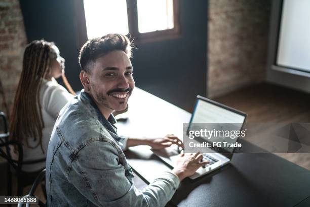 portrait of a mid adult man in the classroom or seminar - study participant stock pictures, royalty-free photos & images