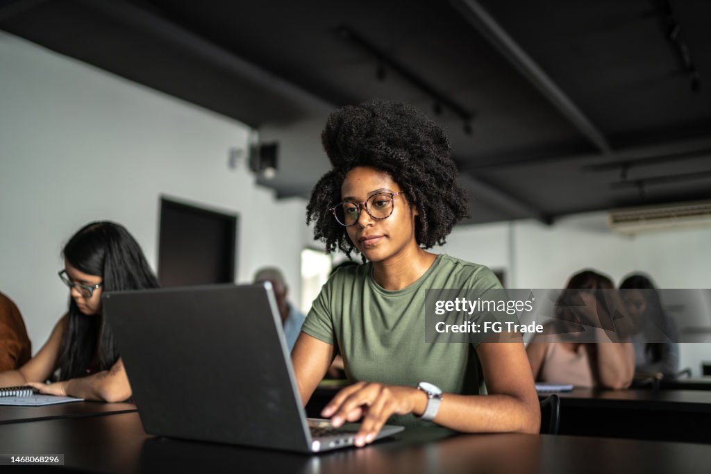 Student using laptop in the classroom