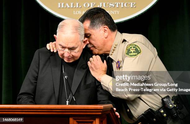 Los Angeles, CA Sheriff Robert Luna consoles Archbishop Jose Gomez during a press conference in Los Angeles on Monday, February 20, 2023. The Los...