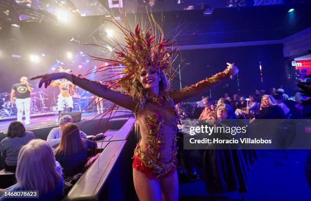 Members of Brazilian Banda Toque de Classe dance during the Band performance of carnival rhythms in Lounge D of Estoril Casino on February 20, 2023...