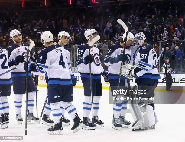 The Winnipeg Jets celebrate a 4-1 victory over the New York Rangers at Madison Square Garden on February 20, 2023 in New York City.